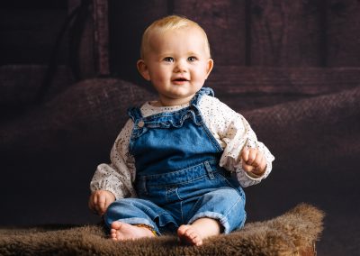 Baby sitting on wooden box