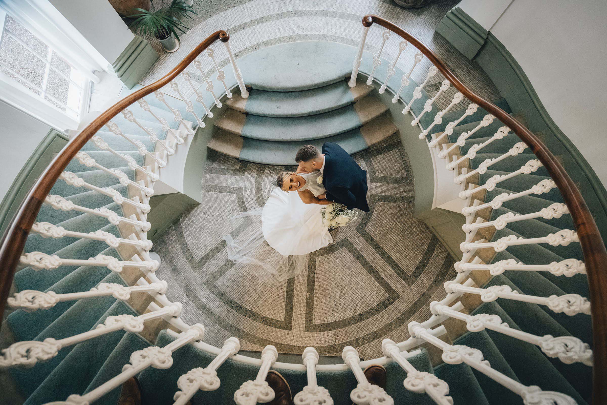 Bride and groom laughing in the Winter Garden