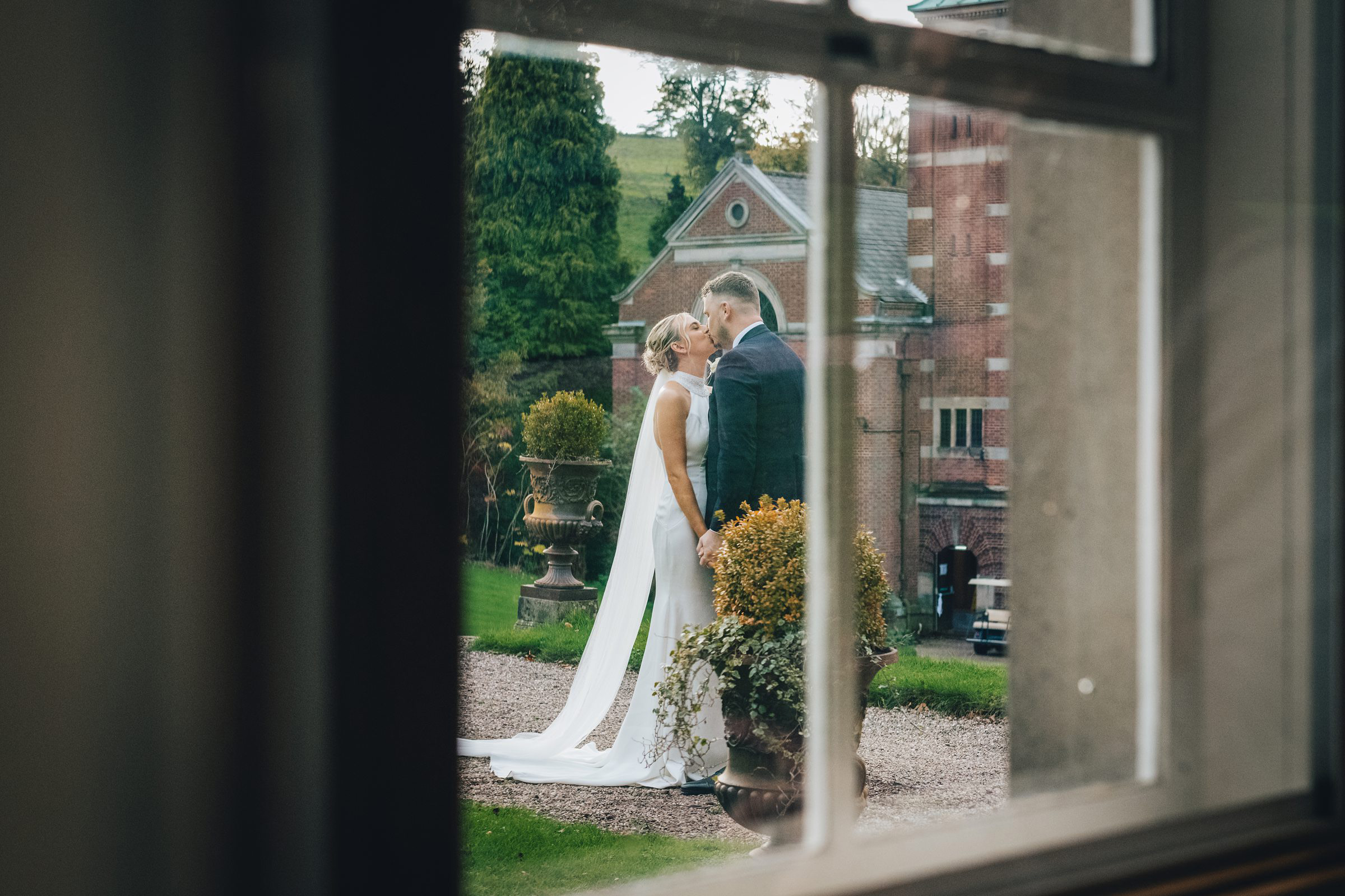 newly wed couple photographed ay Hawkstone hall in the autumn sunshine