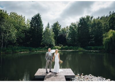bride and groom lakeside at Moddershall oaks