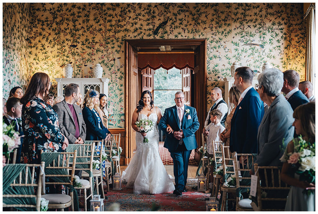 Bride walking into the Drawing Room at Sandon Hall