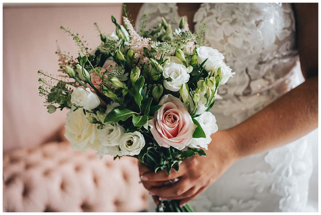Wedding flowers inside Sandon Hall Drawing Room