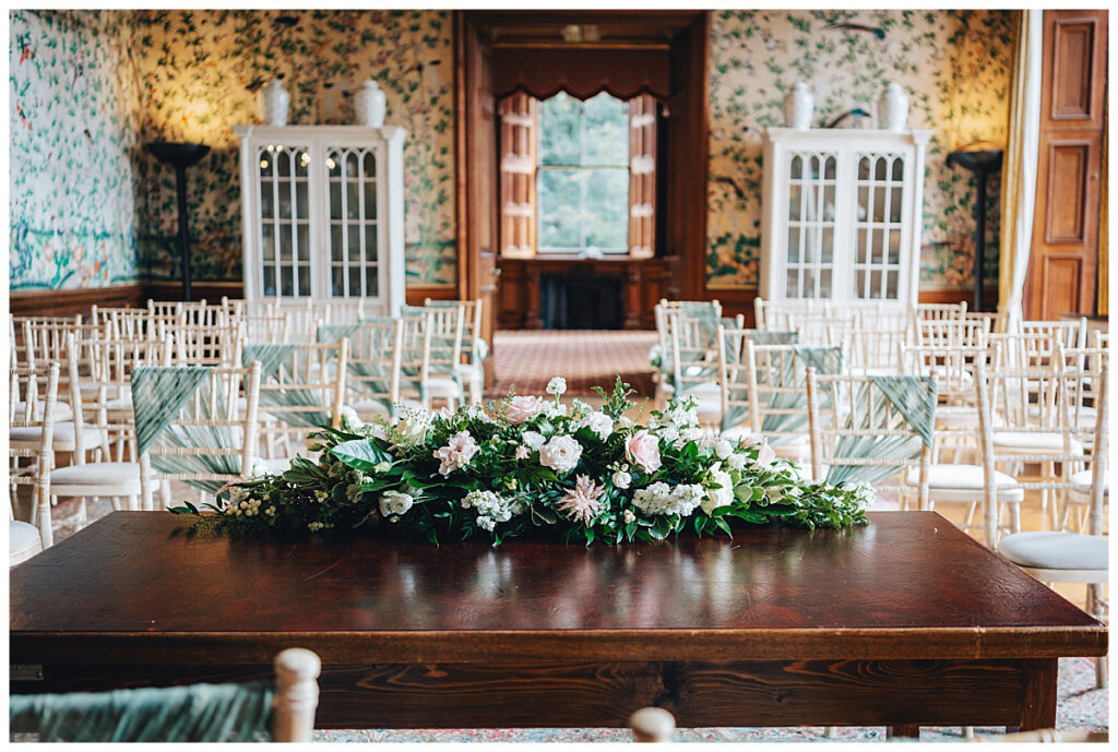 Wedding flowers inside Sandon Hall Drawing Room