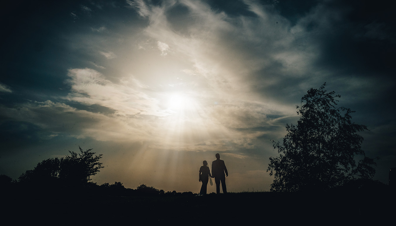 Bride and groom at sunset overlooking Aston Marina in Staffordshire<br />

